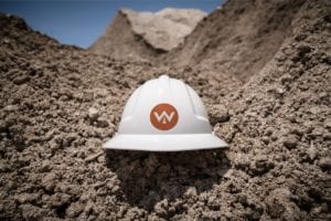 Whitney Logistics helmet with value circle on dirt