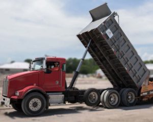 One of Whitney's dump trucks in action at a construction site.
